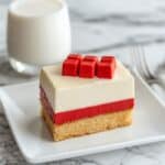 slice of minecraft cake served with milk