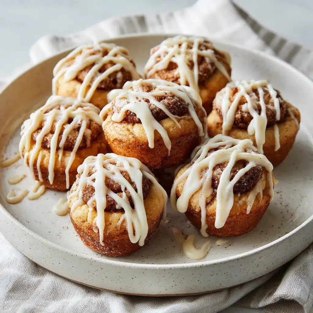 Cinnamon Roll Muffins drizzled with cream cheese glaze